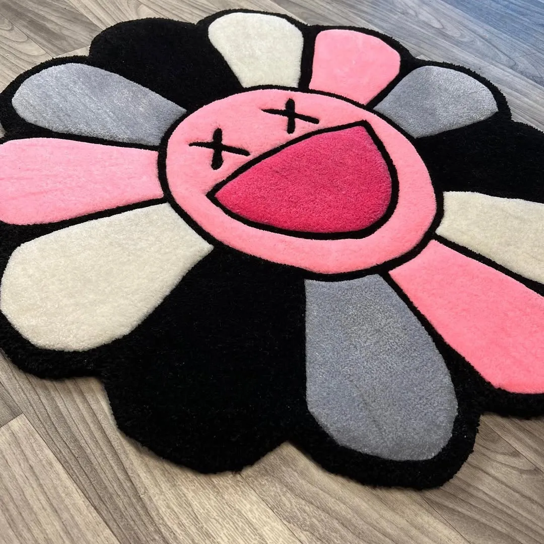 Petal Pop Takashi Rug Colorful Petal Pop Rug made from premium wool, blending soft pinks and greys in a bold flower-shaped art piece.