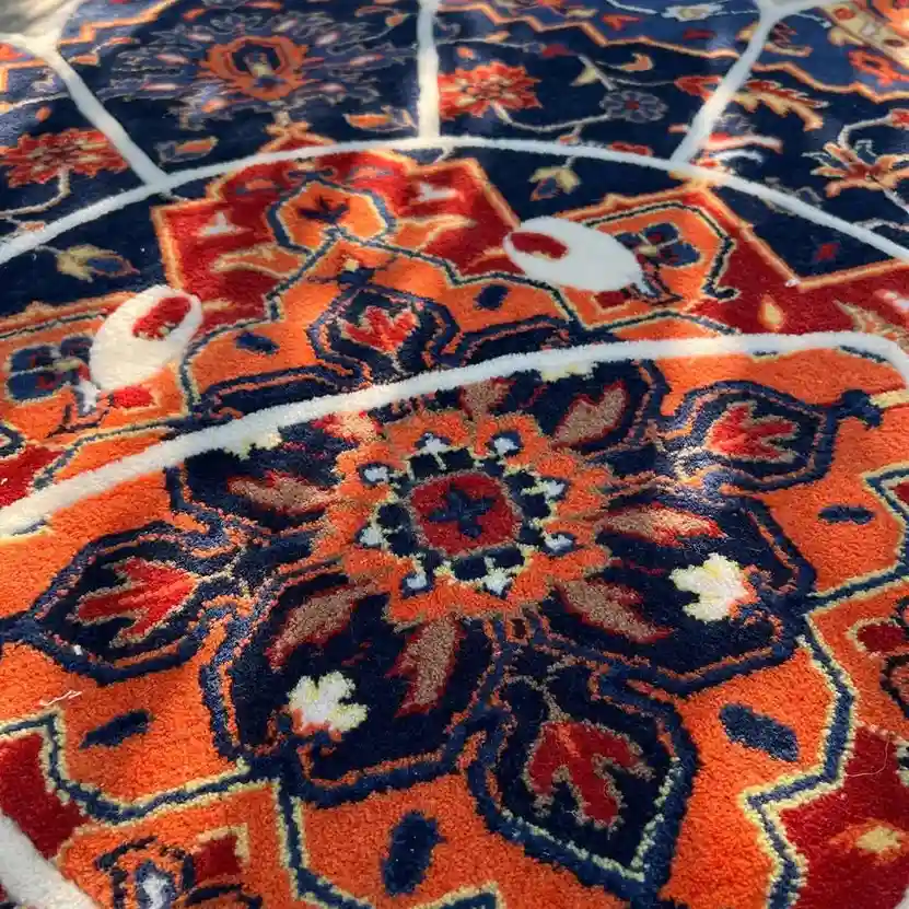Regal Takashi Rug Flower-shaped Regal Bloom Rug combining navy blue, crimson, and orange tones with traditional Persian motifs — perfect as a statement floor piece.