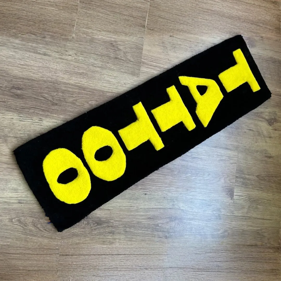 Neon Script Rug Neon Script Rug featuring bright yellow tattoo lettering on black – handmade wool rug by Sneagear