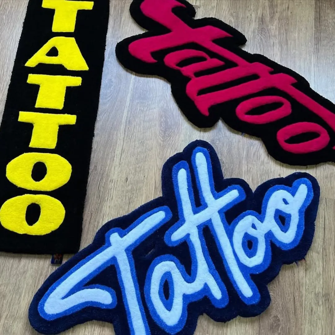 Script Tattoo Rug Hand-tufted wool rug showcasing modern tattoo typography – Arctic Script Rug by Sneagear