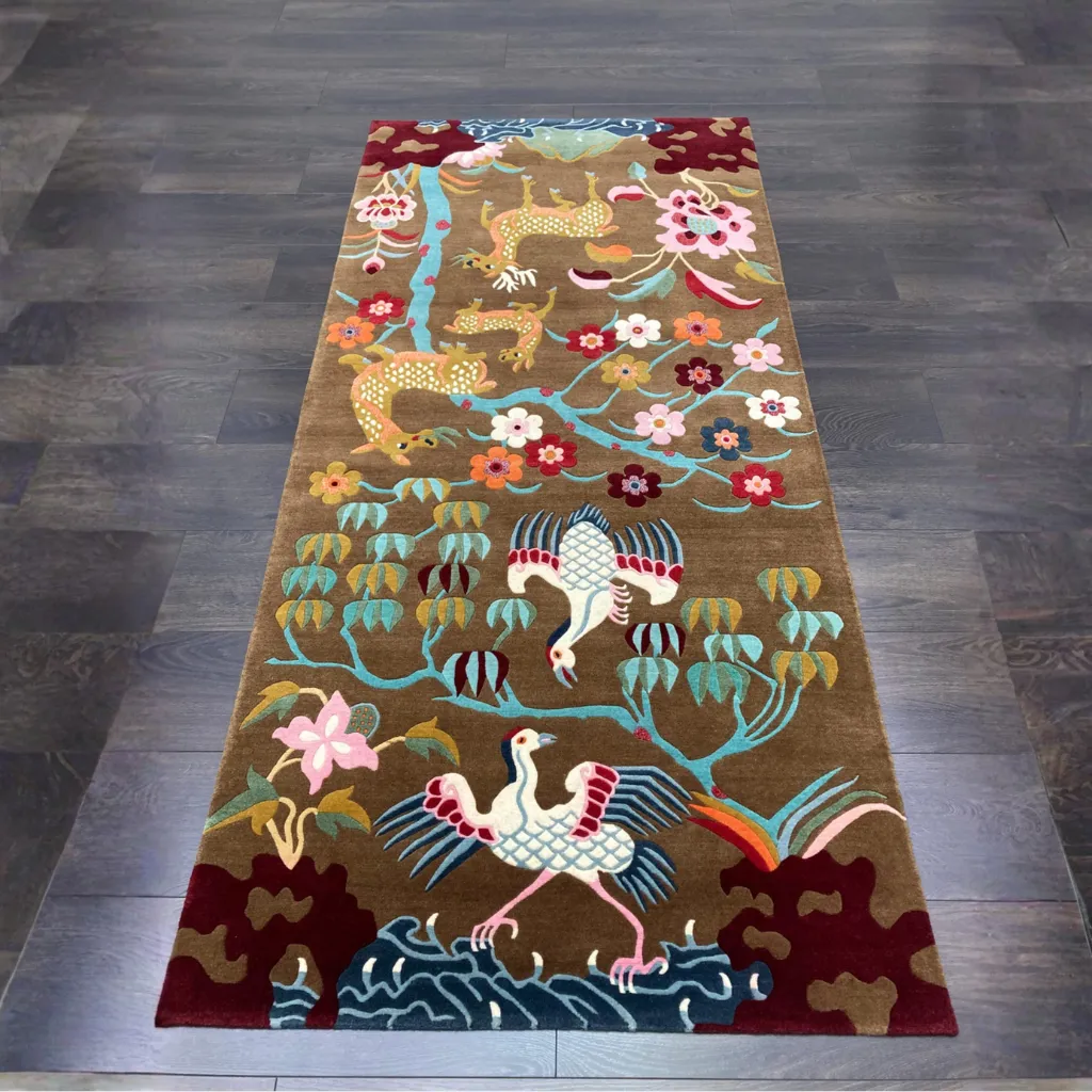 earthen story nature rug Top down full view of the Earthen Story rug featuring a detailed pictorial design with deer, cranes, and blooming trees on a rich brown wool background.
