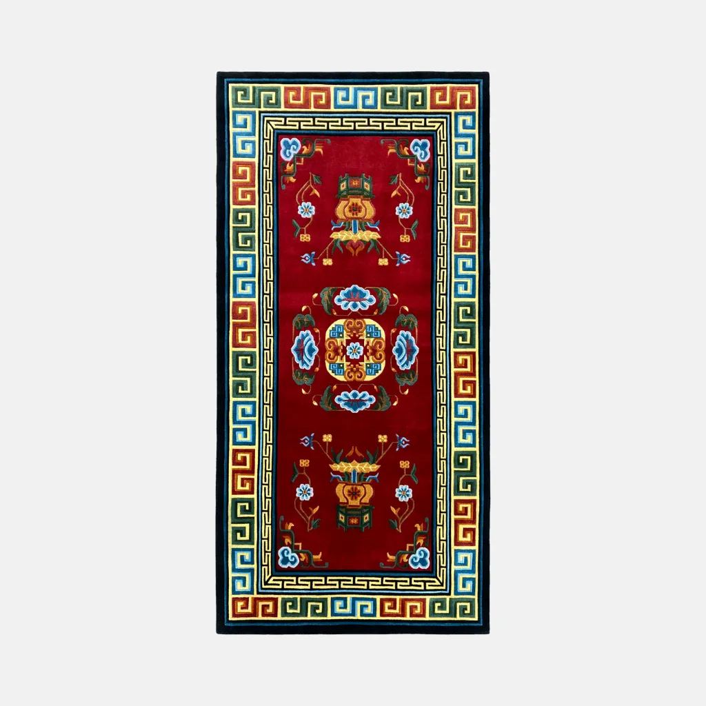 lotus throne red tibetan style rug Top down view of the Lotus Throne rug featuring a traditional Tibetan design with a central mandala motif and geometric meander borders on a deep red background.