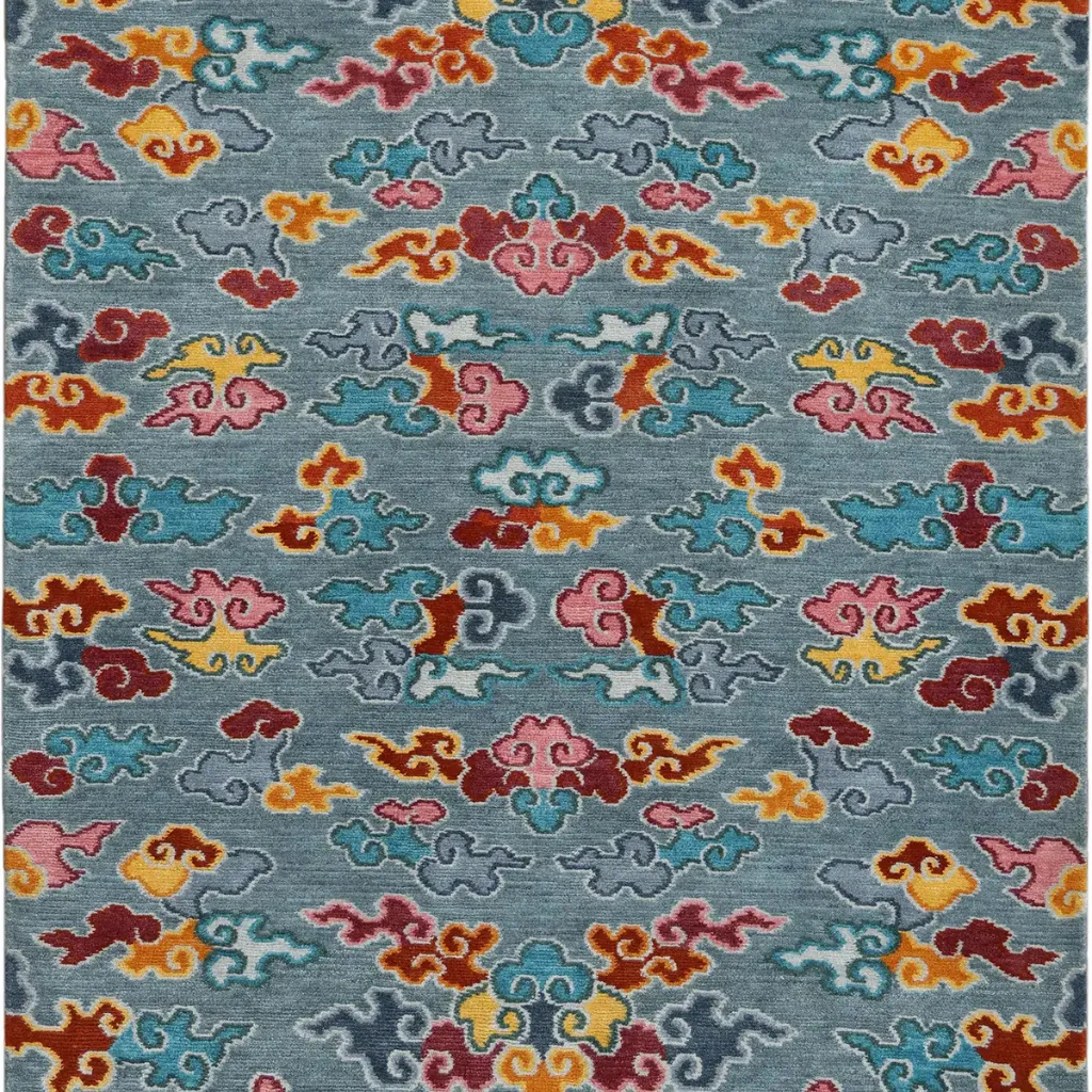 nomad horizon rug wool texture detail Close up detail shot of the Nomad Horizon rug highlighting the dense hand tufted wool texture and the vibrant colors of the geometric cloud motifs.