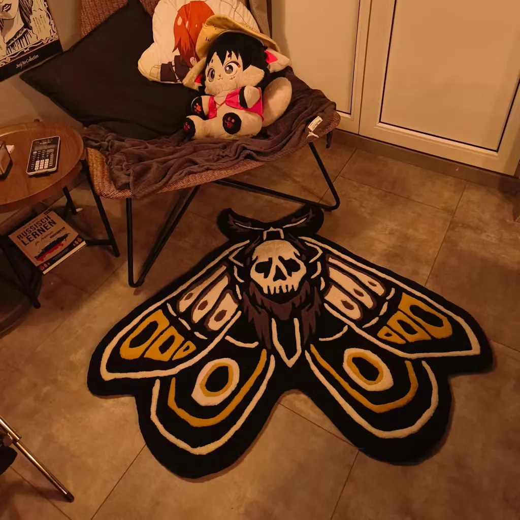 skull moth rug bedroom decor he Gold Death Moth rug placed in a modern living room, adding a unique alternative decor element to the space with its striking insect shape.