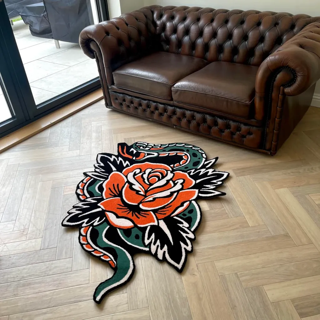 Traditional Snake Rose Flash Art Area Rug Angled perspective of the Snake Rose Traditional rug featuring a custom die cut shape with a classic serpent and flower motif hand tufted in dense wool.