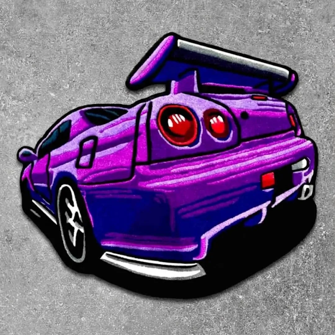 arrow crest purple sports car rug Top down view of the Arrow Crest rug featuring a custom die-cut design of a purple JDM sports car rear with a large spoiler and iconic round red taillights.