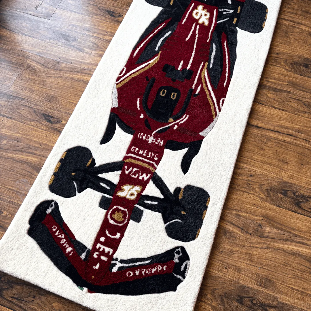 scarlet force ferrari style race car rug Angled view of the Scarlet Force rug, highlighting the rich maroon and red tones of the race car design and the soft hand-tufted wool texture.