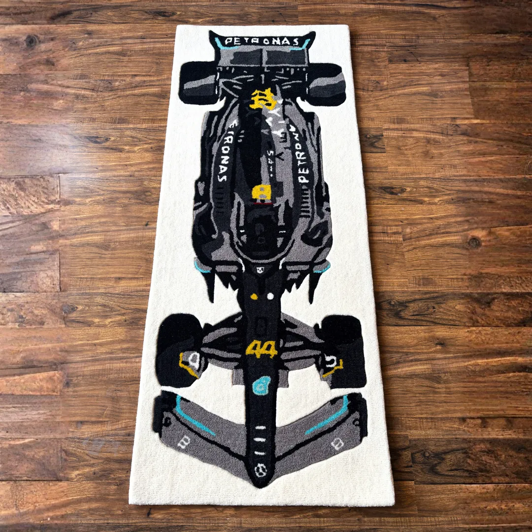 scarlet pulse black f1 car runner rug Top down view of the Scarlet Pulse runner rug featuring a detailed illustration of a black and silver Formula 1 race car with the number 44 and teal accents.