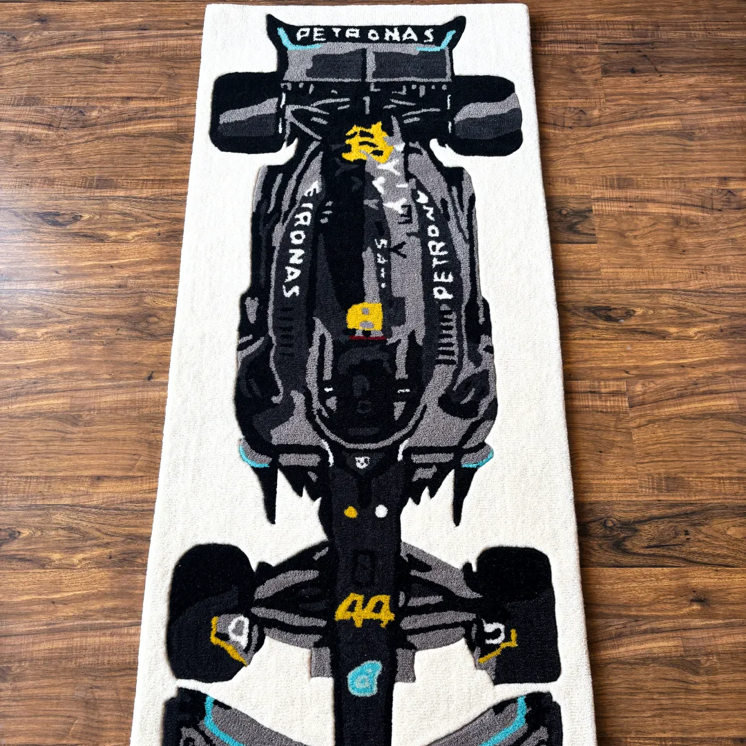 scarlet pulse formula 1 runner rug number 44 Perspective view of the Scarlet Pulse rug placed on a wooden floor, highlighting the tufted wool texture of the black race car design with Petronas-inspired livery.