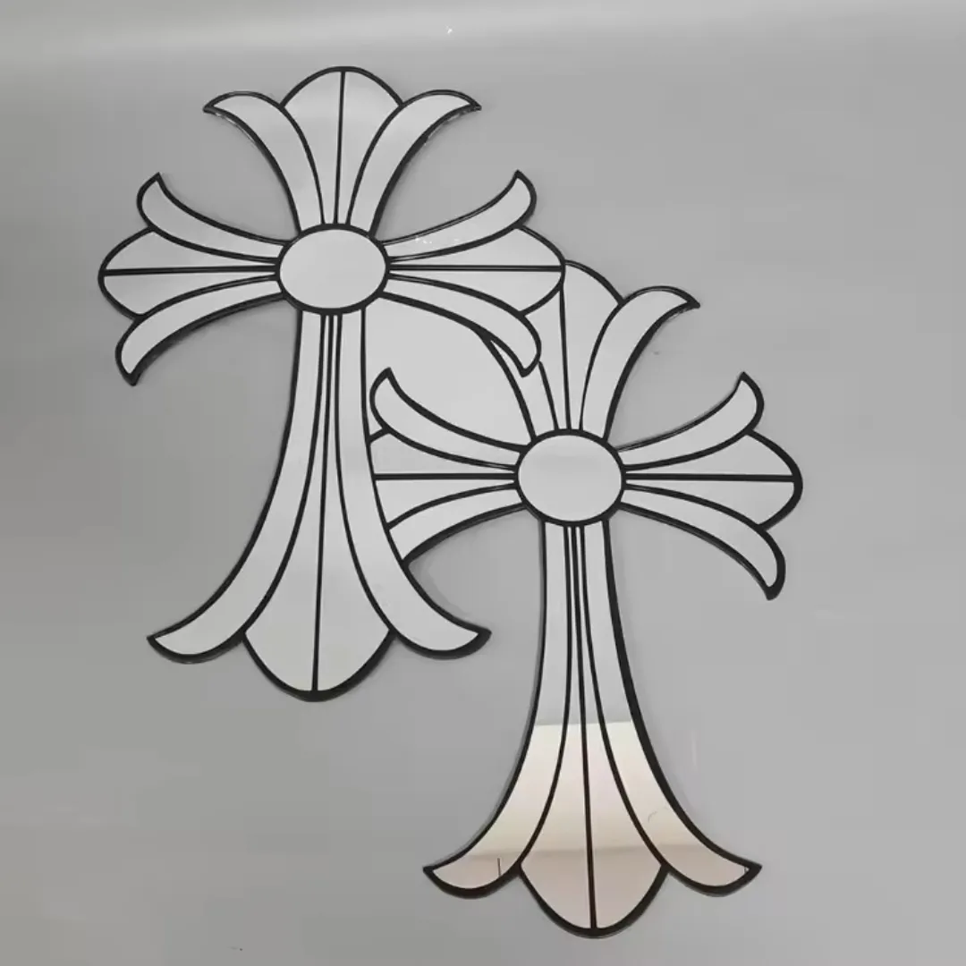 gothic cross mirrors flat lay Two stylized gothic cross-shaped mirrors with thick black outlines lying flat against a light grey background.