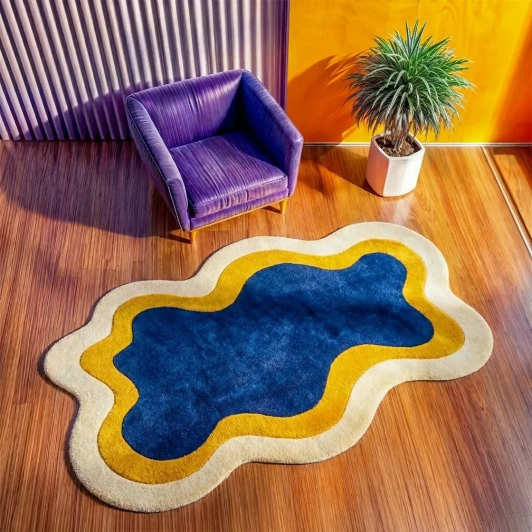 noctail glow rug angle High-angle lifestyle view of the Noctail Glow rug showcasing its plush, hand-tufted wool texture and the elegant, curved design of its blue, yellow, and cream layers in a bright, sunlit interior.