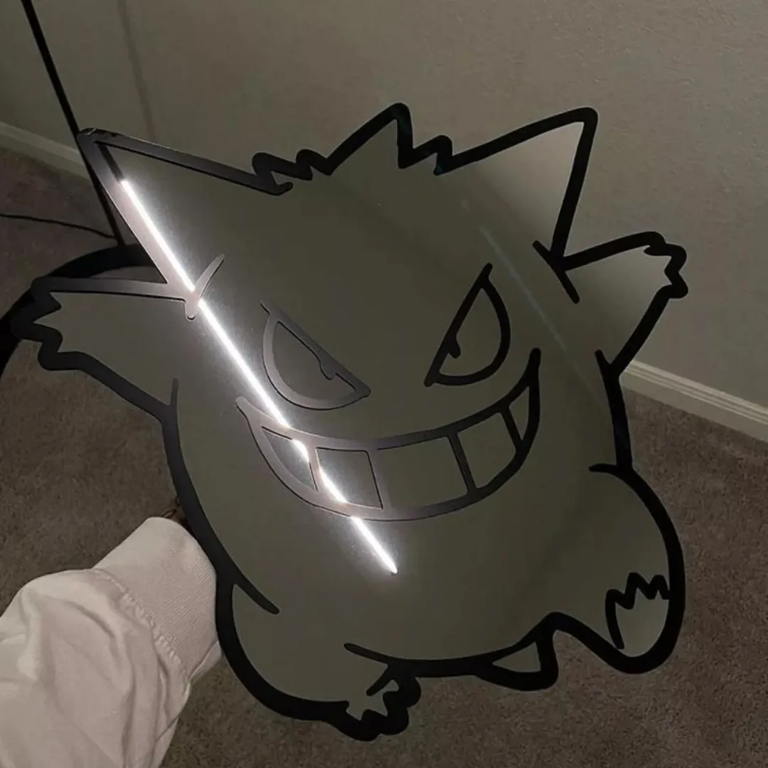 spooky ghost mirror ghost decal detail Close-up, angled view of the Spooky Ghost Mirror, focusing on the cute white ghost decal and reflecting bright light, showcasing the smooth glass surface.