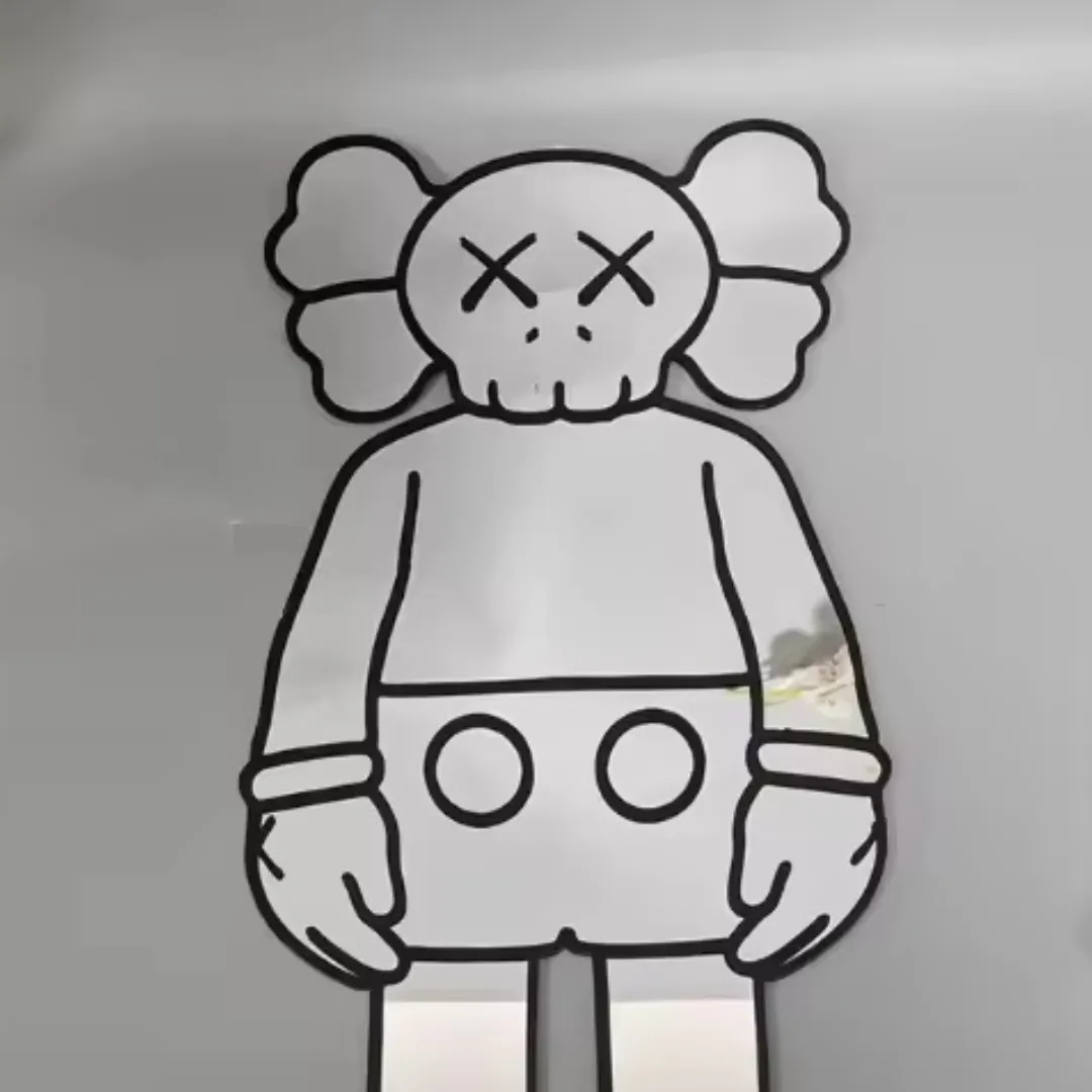 street bear mirror close up reflection Close-up view of the Street Bear mirror lying flat, showcasing the bold black outlines of the character's face and reflecting a bright room environment.