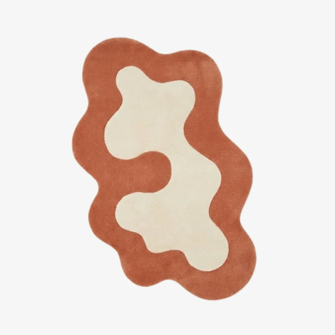terrand form rug top Top-down view of the Terrand Form rug against a white background, featuring a fluid, organic wavy silhouette with a bold terracotta orange border surrounding a central cream-colored abstract shape.