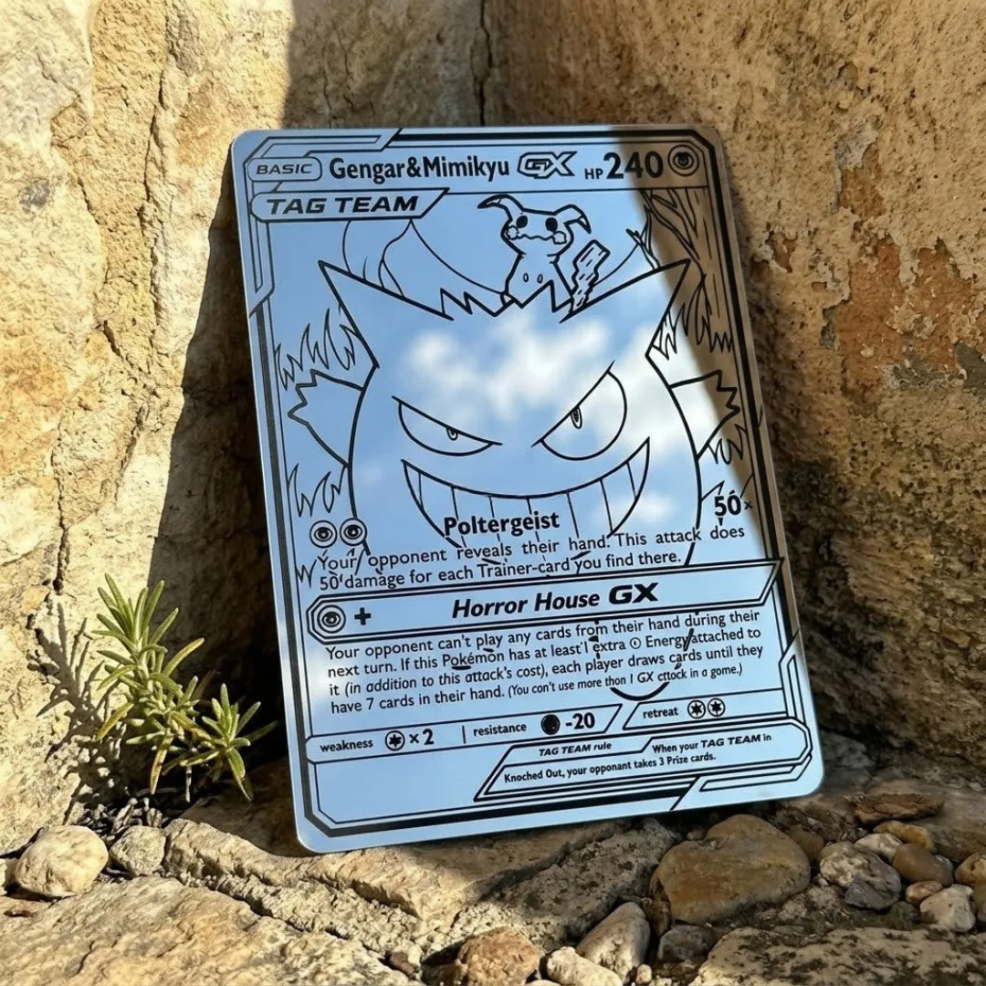 ghost duo mirror decor stone Ghost Duo Mirror Wall Decor leaning against natural stone in warm sunlight, highlighting the etched character details and reflecting a clear blue sky.