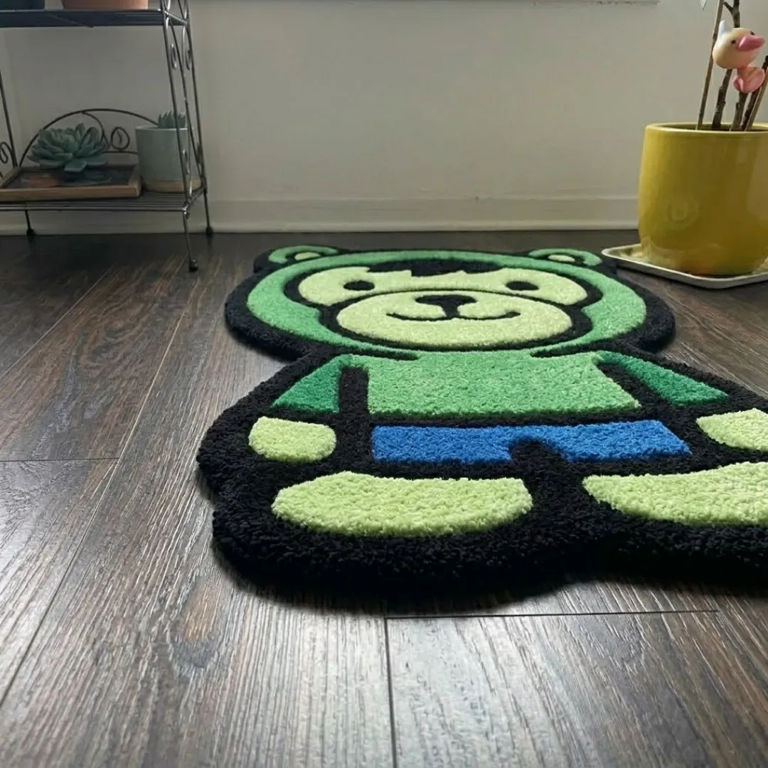 gamma fury rage shaped area rug perspective detail An angled perspective shot of a hand-tufted gamma fury rage rug, highlighting its playful silhouette and high-quality tufted wool texture on a wooden floor.