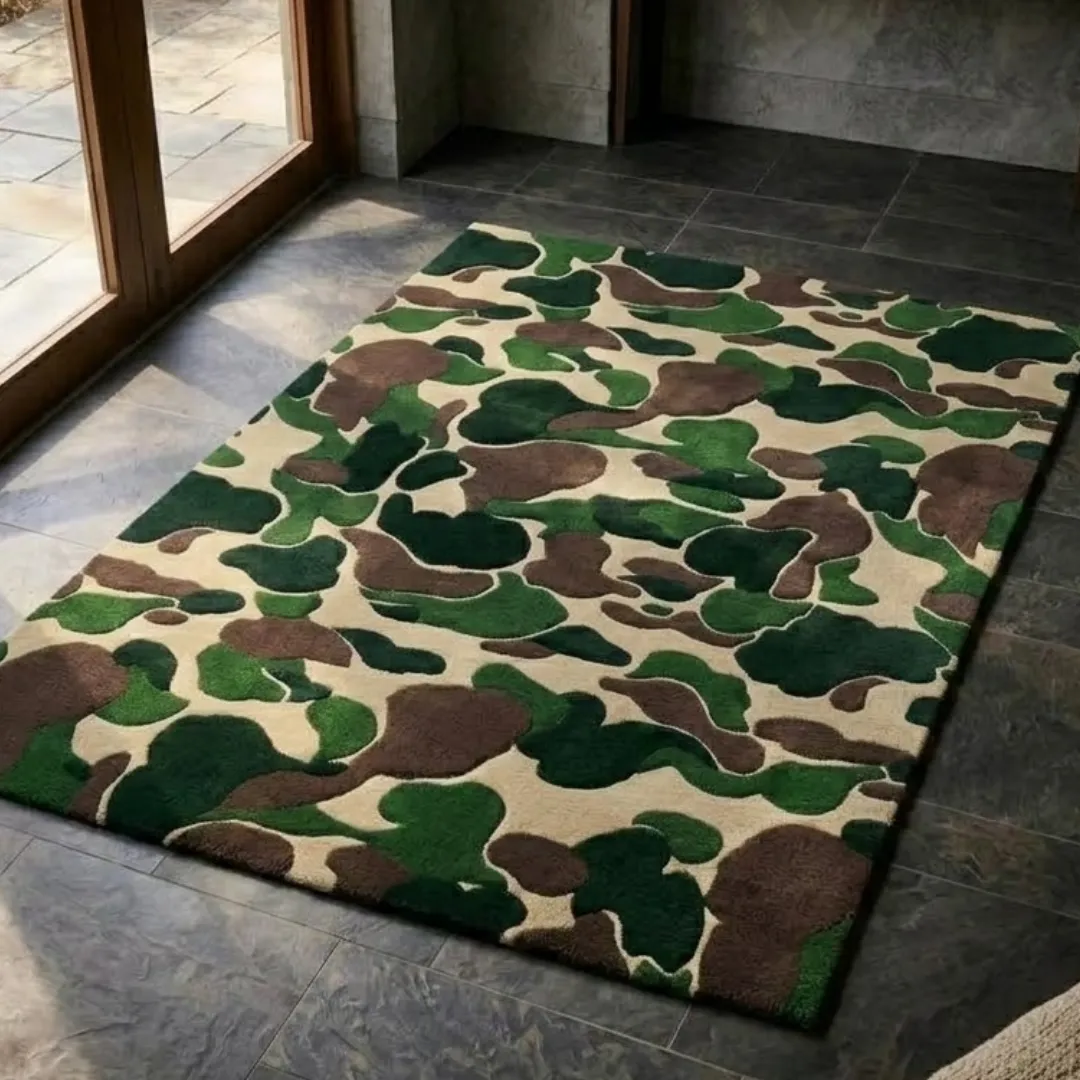 shadowfield camo terrain area rug perspective detail An angled perspective shot of a hand-tufted shadowfield camo terrain rug, highlighting its detailed tactical print and high-quality wool texture on a tiled floor near a glass door.