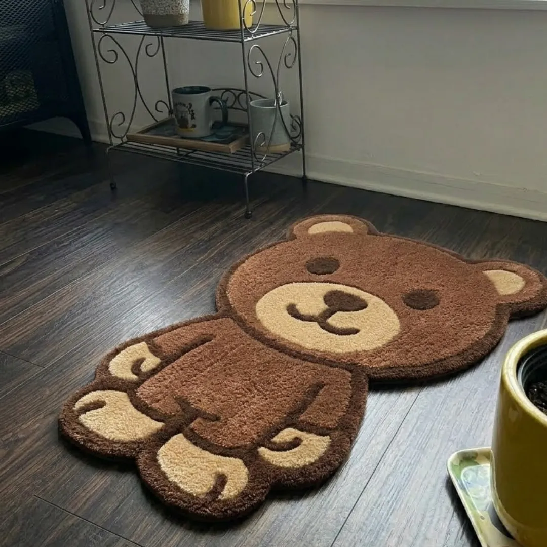 webstrike phantom shaped area rug perspective detail An angled perspective shot of a hand-tufted webstrike phantom rug, highlighting its playful bear silhouette and high-quality tufted wool texture on a wooden floor.